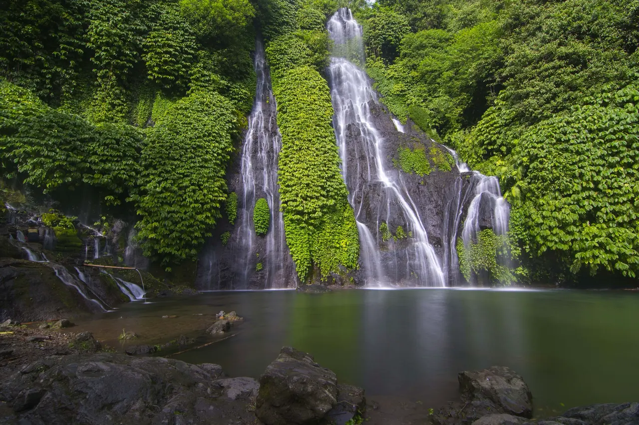 A twin waterfall in lush jungle